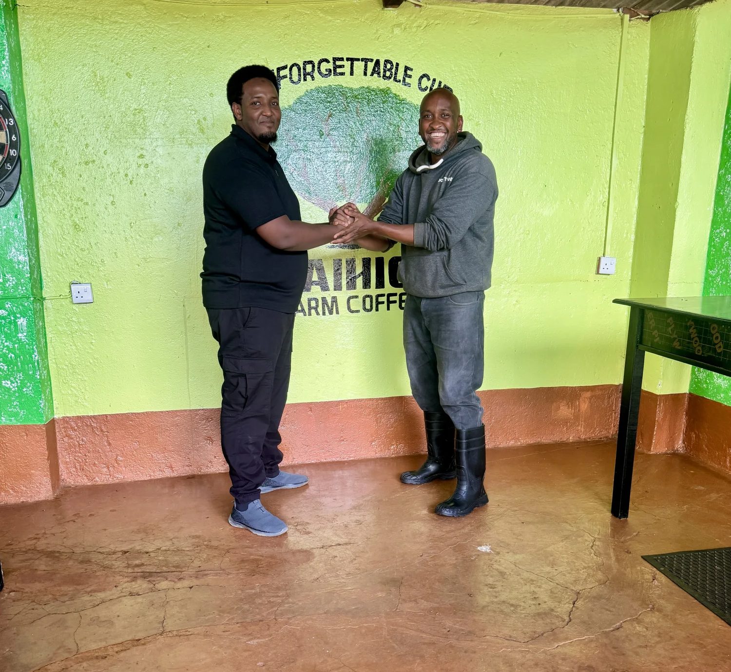 Handshake between The Coffee Conduit and a producer at Waihiga Farm, Nyeri, Kenya